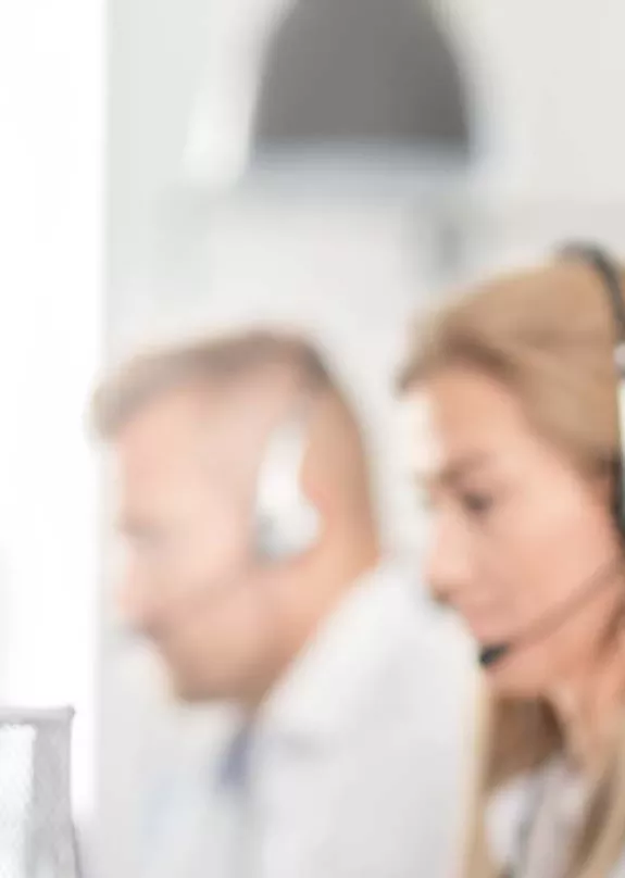 Sales person using headset to speak to customer